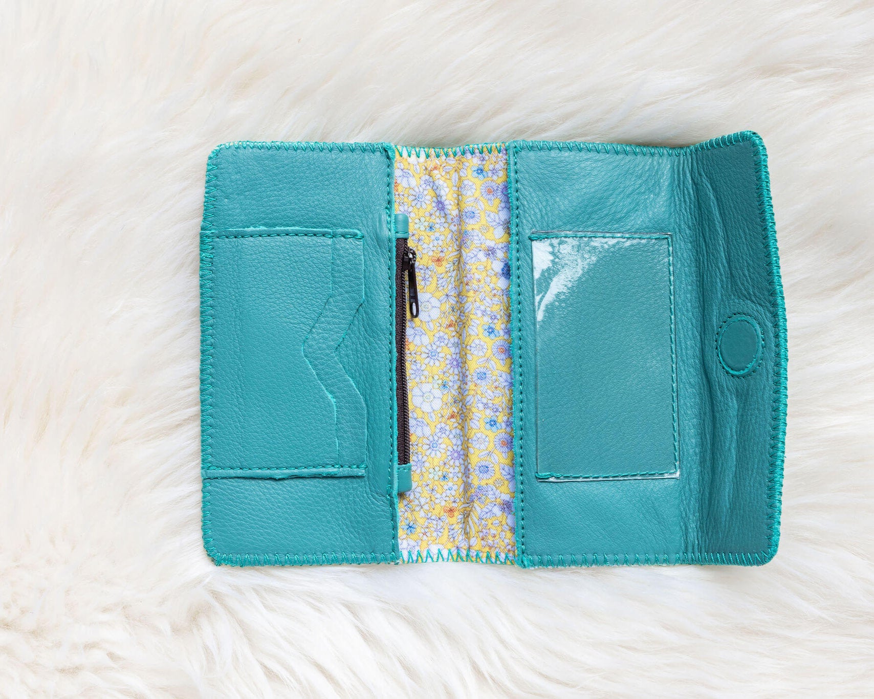 Turquoise leather wallet for traveling