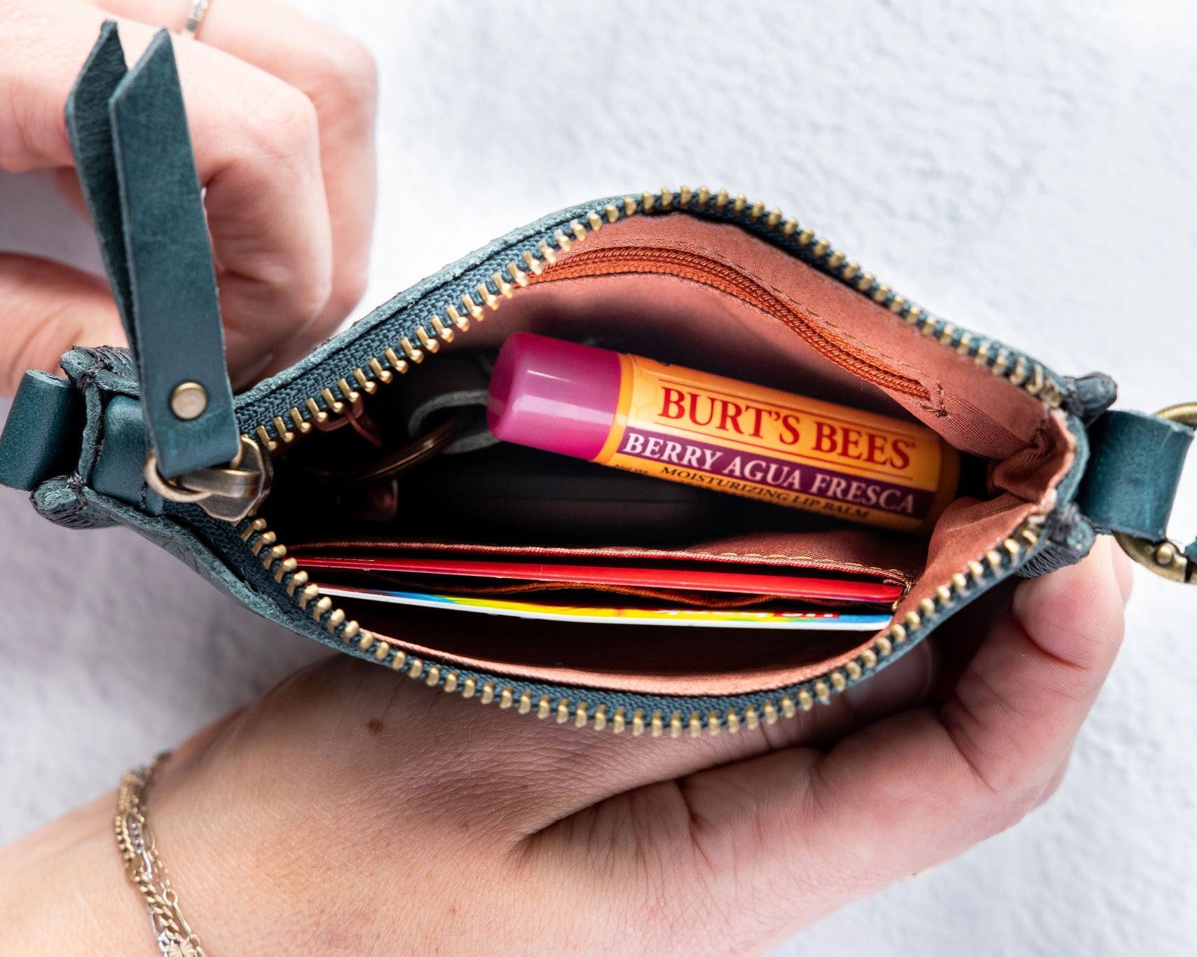 Mini teal leather pouch