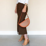 The Woven Terracotta & Seashell Biggie Bee styled with a midi skirt