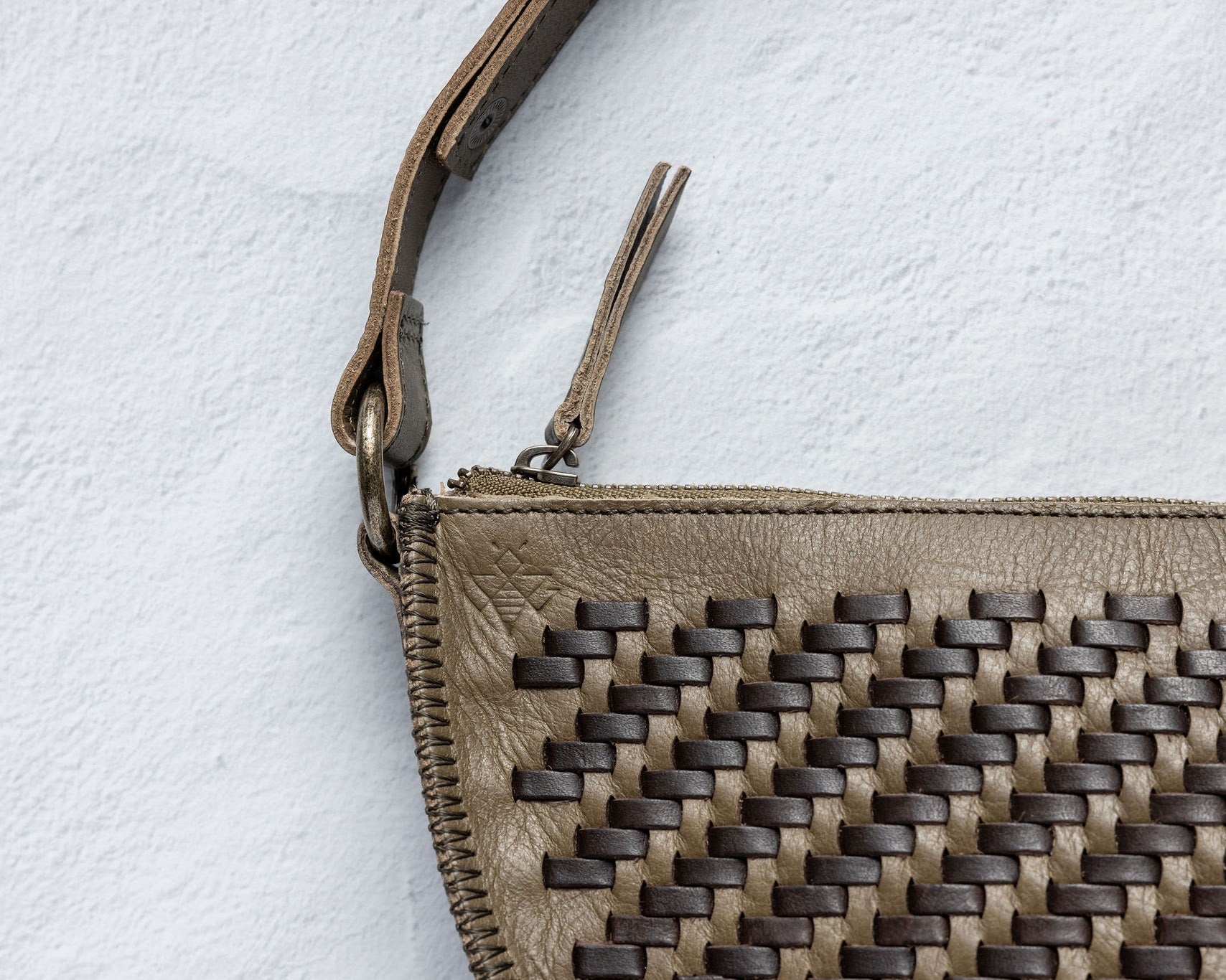 Close-up of the handwoven herringbone leather on the Woven Queen Bee