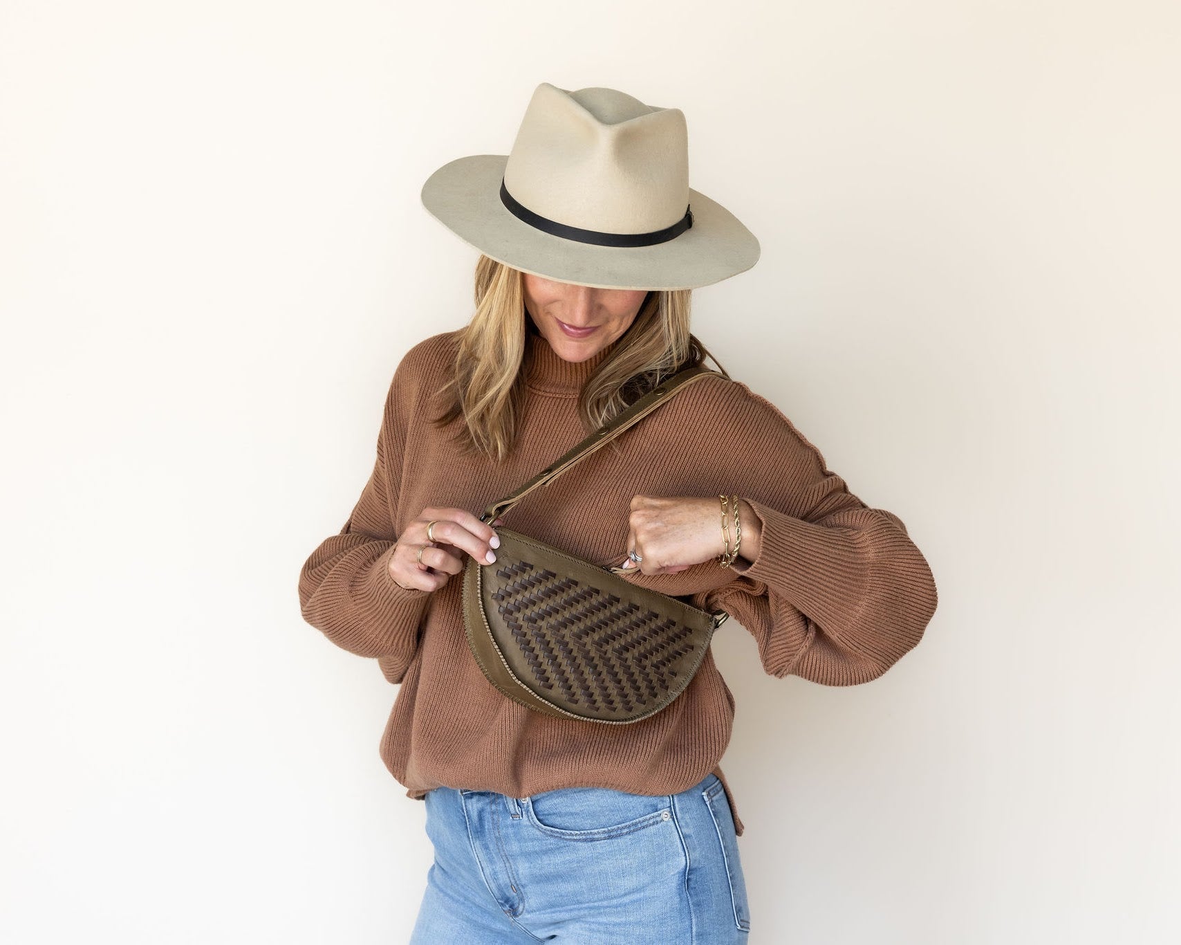 The Woven Sage & Espresso Bee worn as a shoulder bag