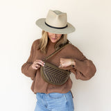 The Woven Sage & Espresso Bee worn as a shoulder bag