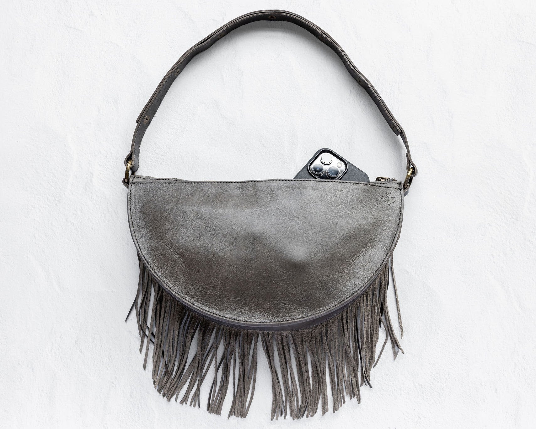 Large charcoal leather fringe crossbody bag, back with phone pocket