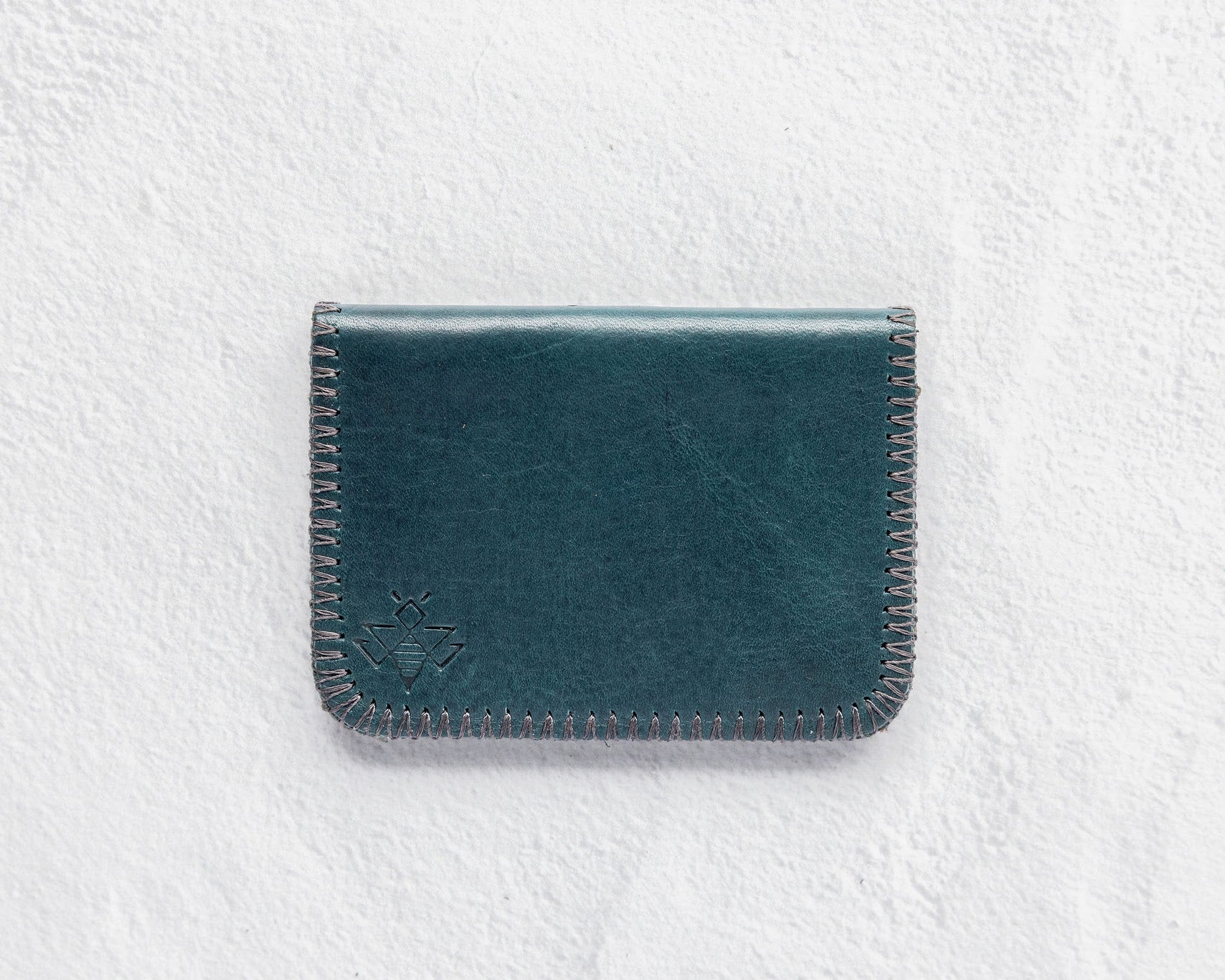 Small teal leather wallet