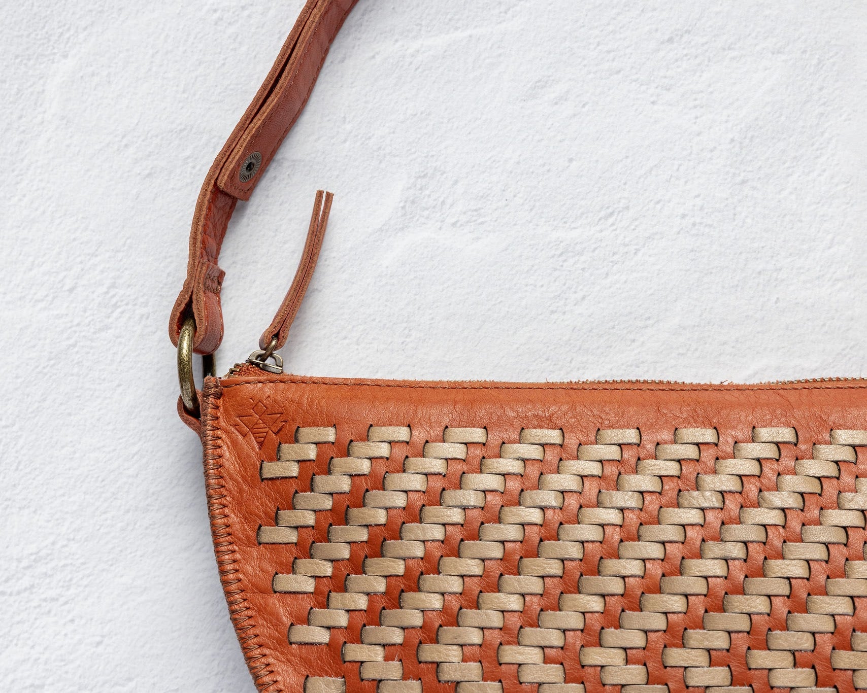 Close-up of the handwoven herringbone leather on the Woven Bee
