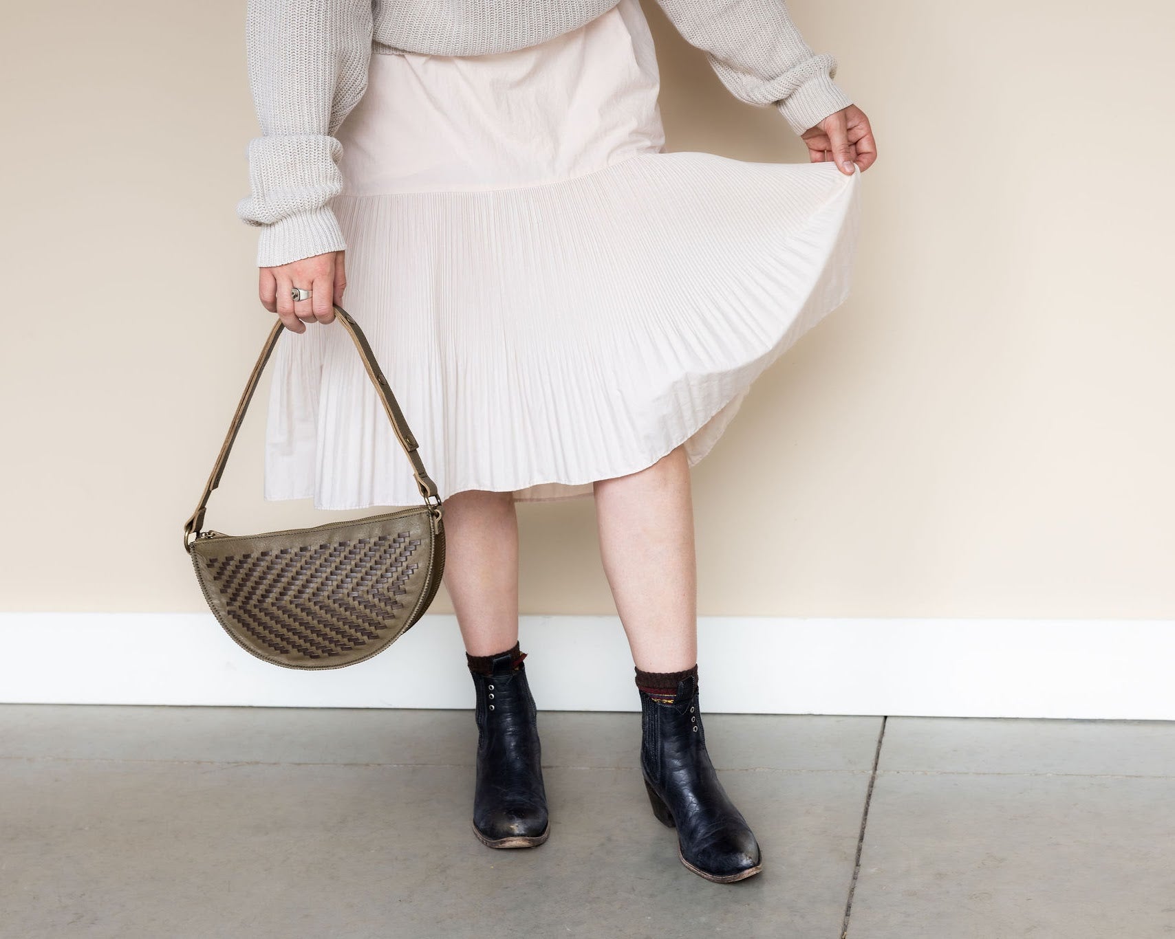 The Woven Sage & Espresso Biggie Bee styled with a midi skirt