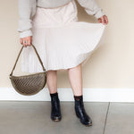 The Woven Sage & Espresso Biggie Bee styled with a midi skirt