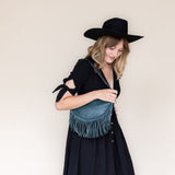 Medium teal leather fringe bag, side view