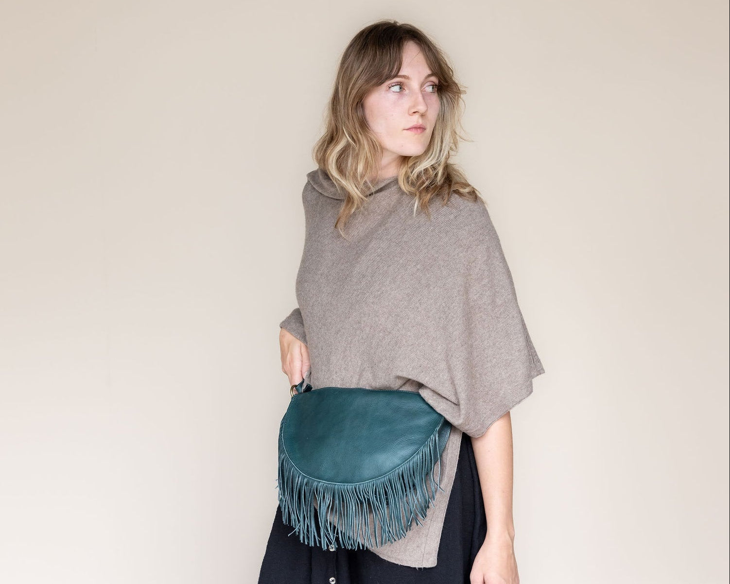 Large teal leather fringe belt bag