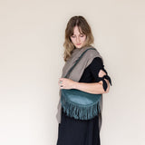 Large teal leather fringe bag, side view
