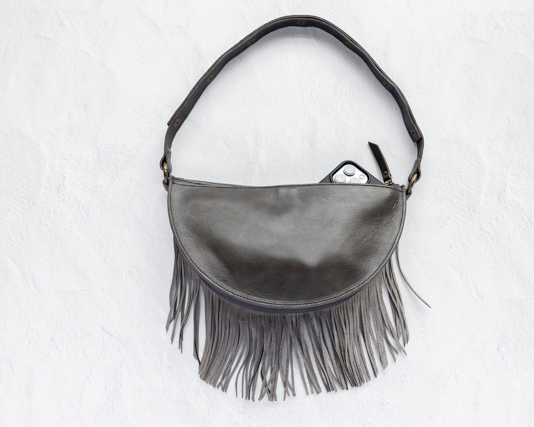 Medium charcoal leather fringe crossbody bag, back with phone pocket