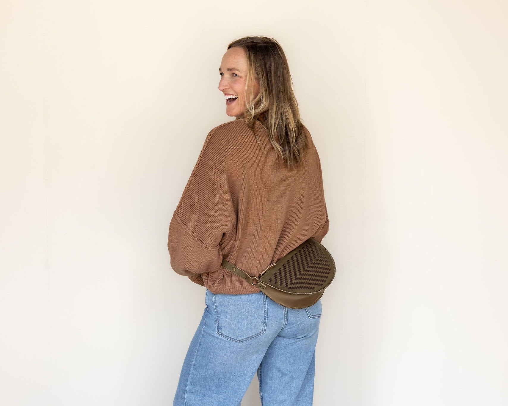 The Woven Sage & Espresso Biggie Bee worn at the waist
