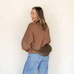 The Woven Sage & Espresso Biggie Bee worn at the waist