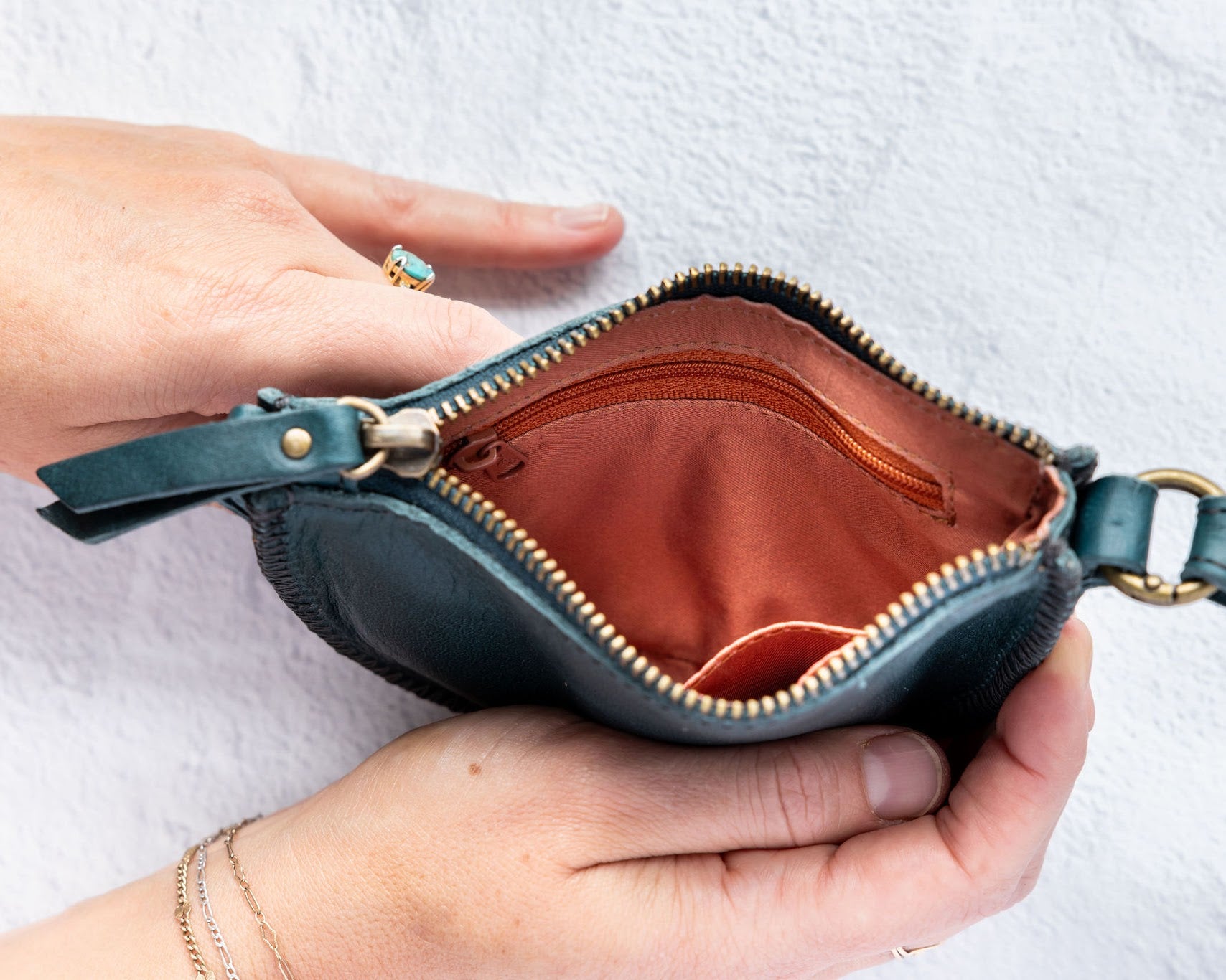 Mini teal leather pouch