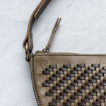 Close-up of the handwoven herringbone leather on the Woven Biggie Bee