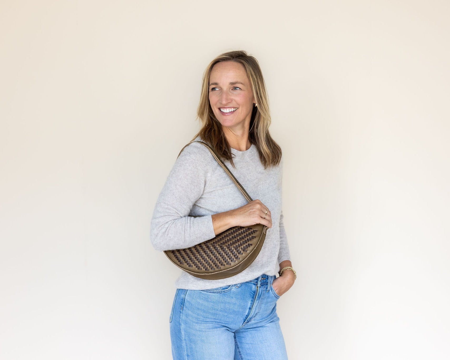 The Woven Sage & Espresso Queen Bee worn on the shoulder