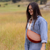 Woman wearing the Woven Terracotta & Seashell Queen Bee crossbody