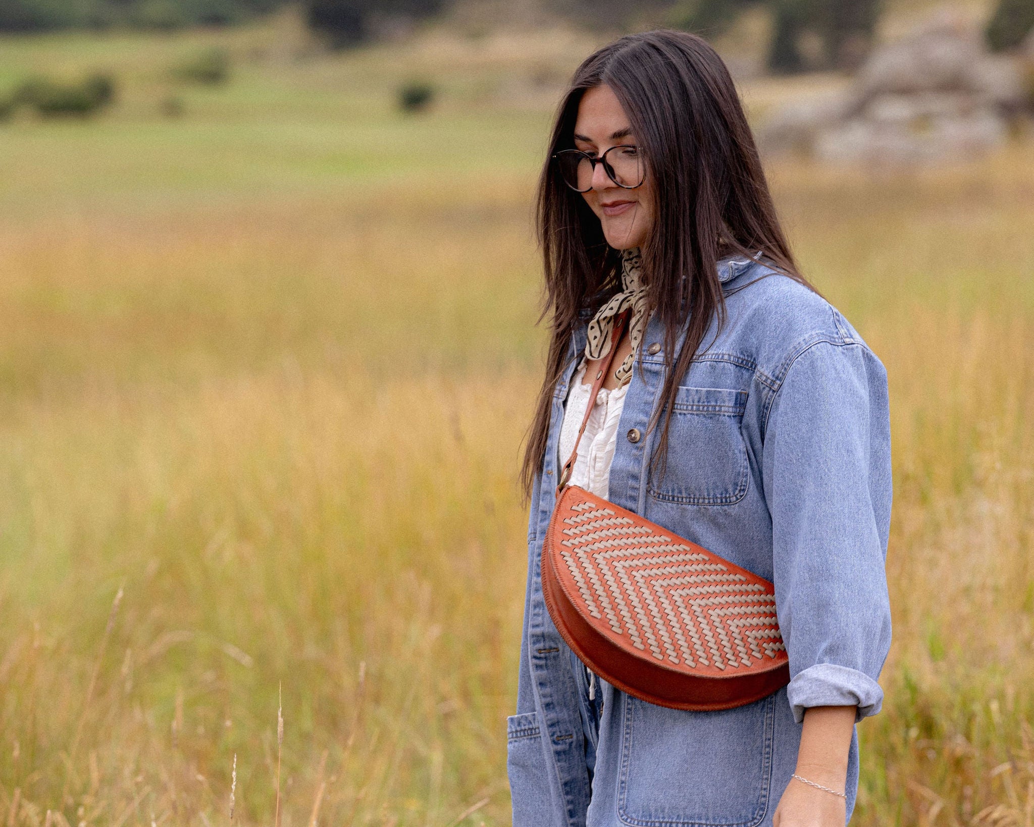 Woman wearing the Woven Terracotta & Seashell Queen Bee crossbody