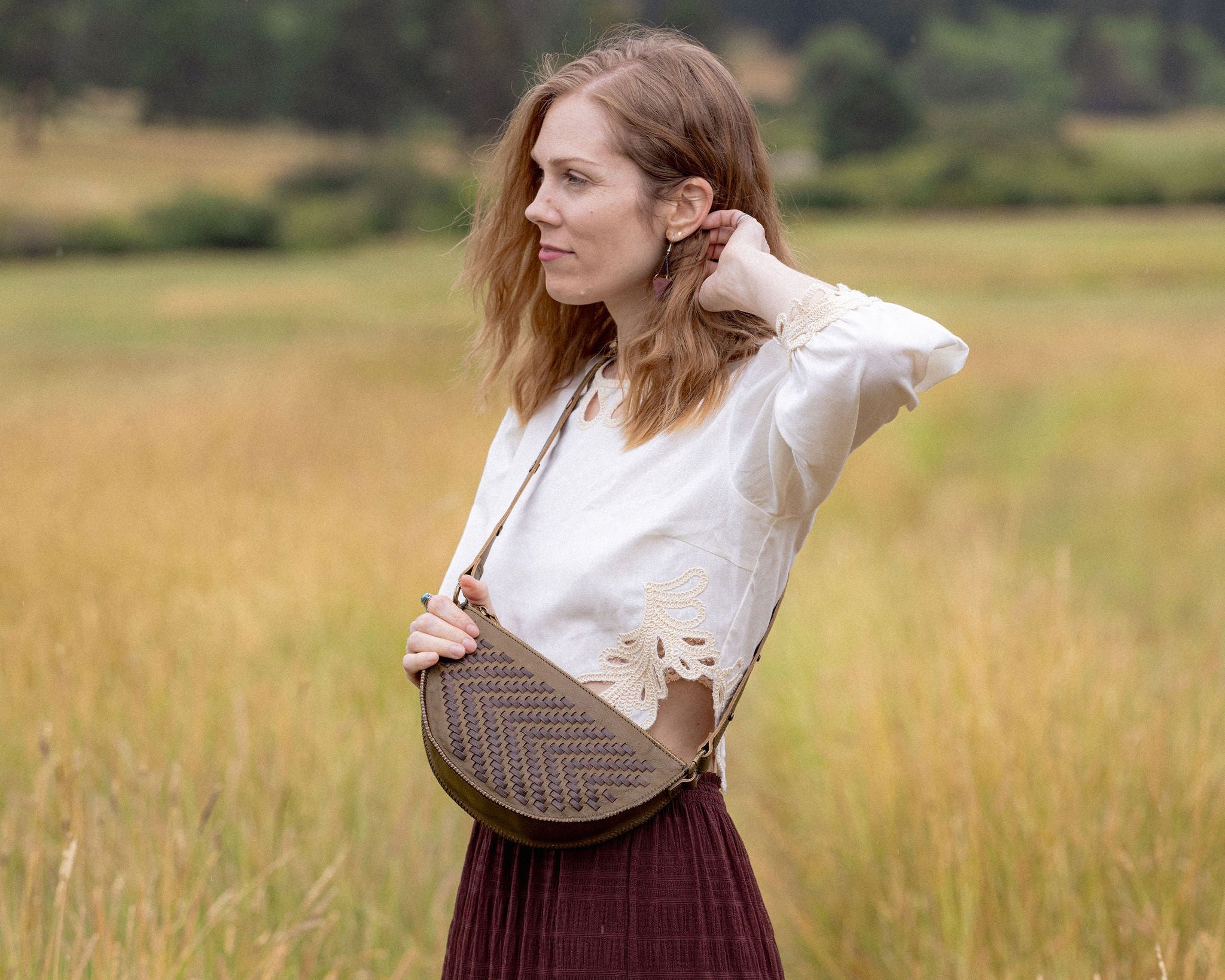 Woman wearing the Woven Sage & Espresso Bee as a crossbody bag
