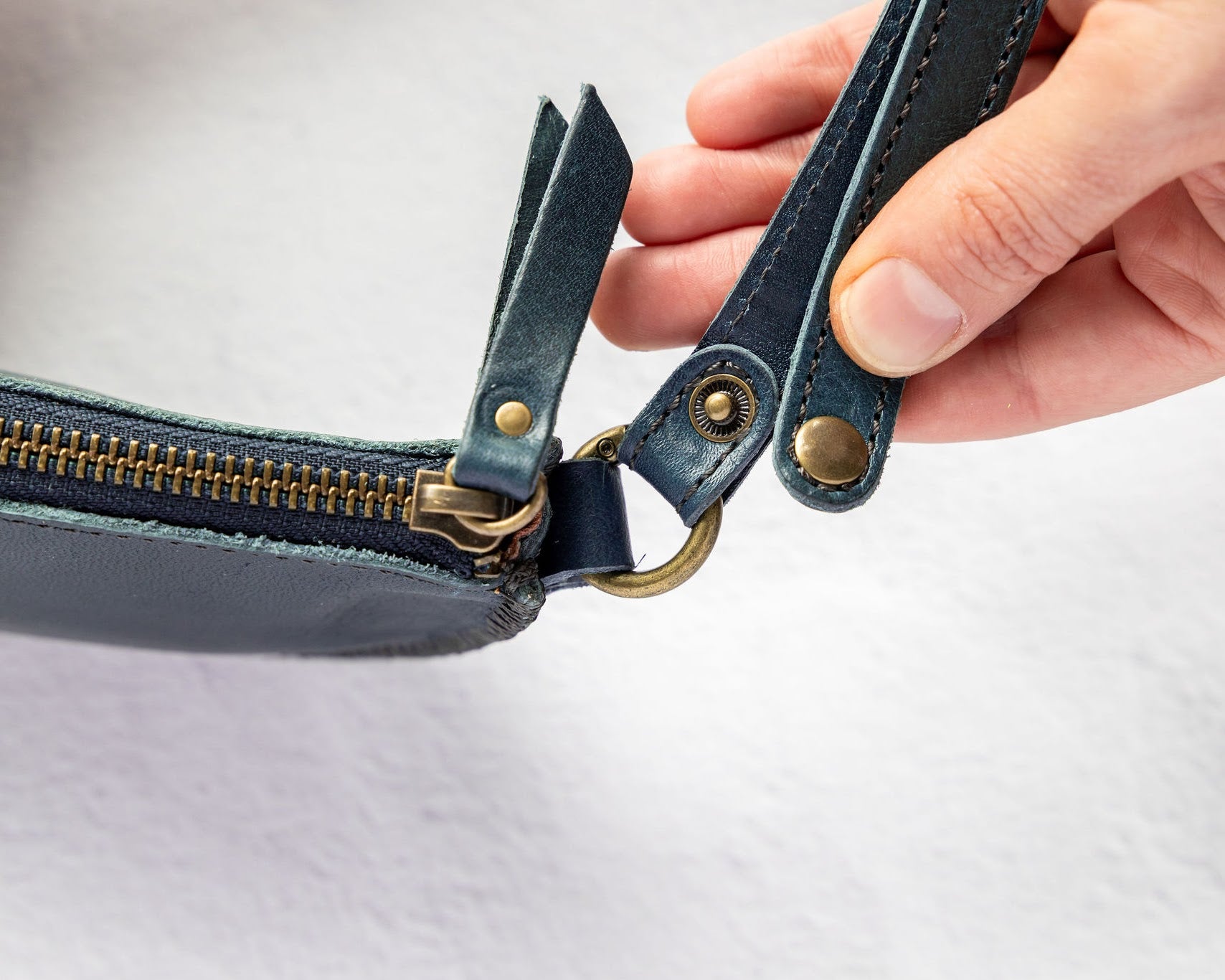 Mini teal leather pouch