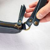 Mini teal leather pouch