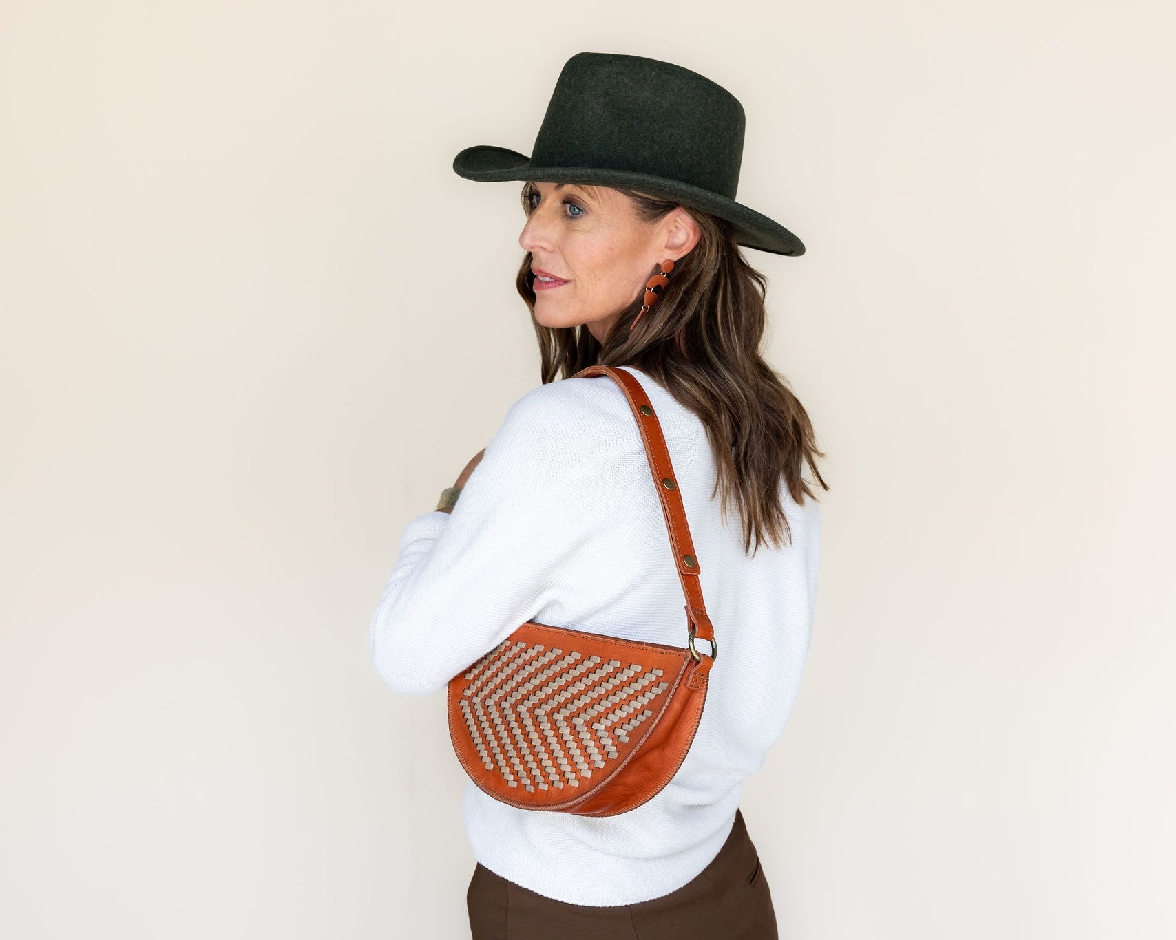 The Woven Terracotta & Seashell Biggie Bee worn on the shoulder