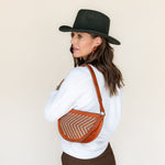 The Woven Terracotta & Seashell Biggie Bee worn on the shoulder