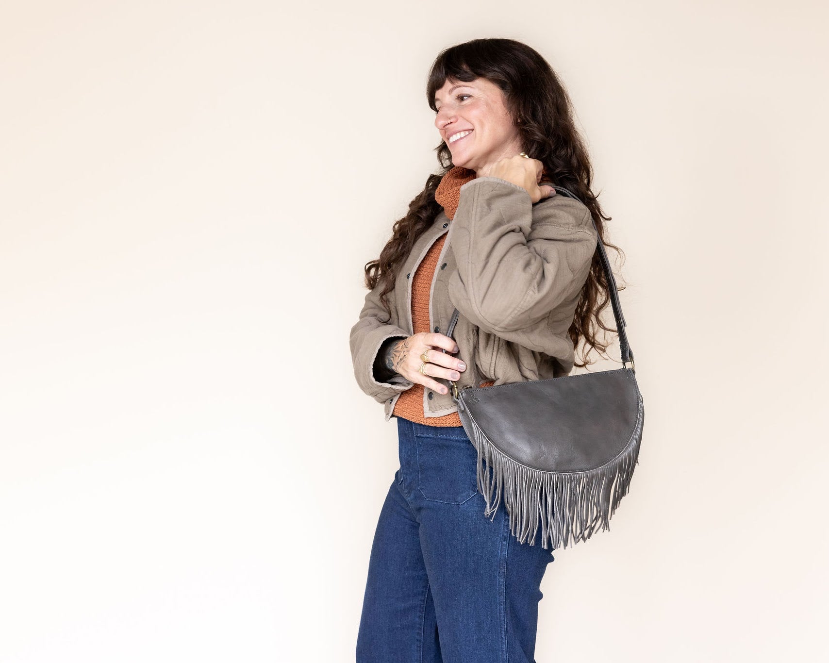 Medium charcoal leather fringe bag, side view