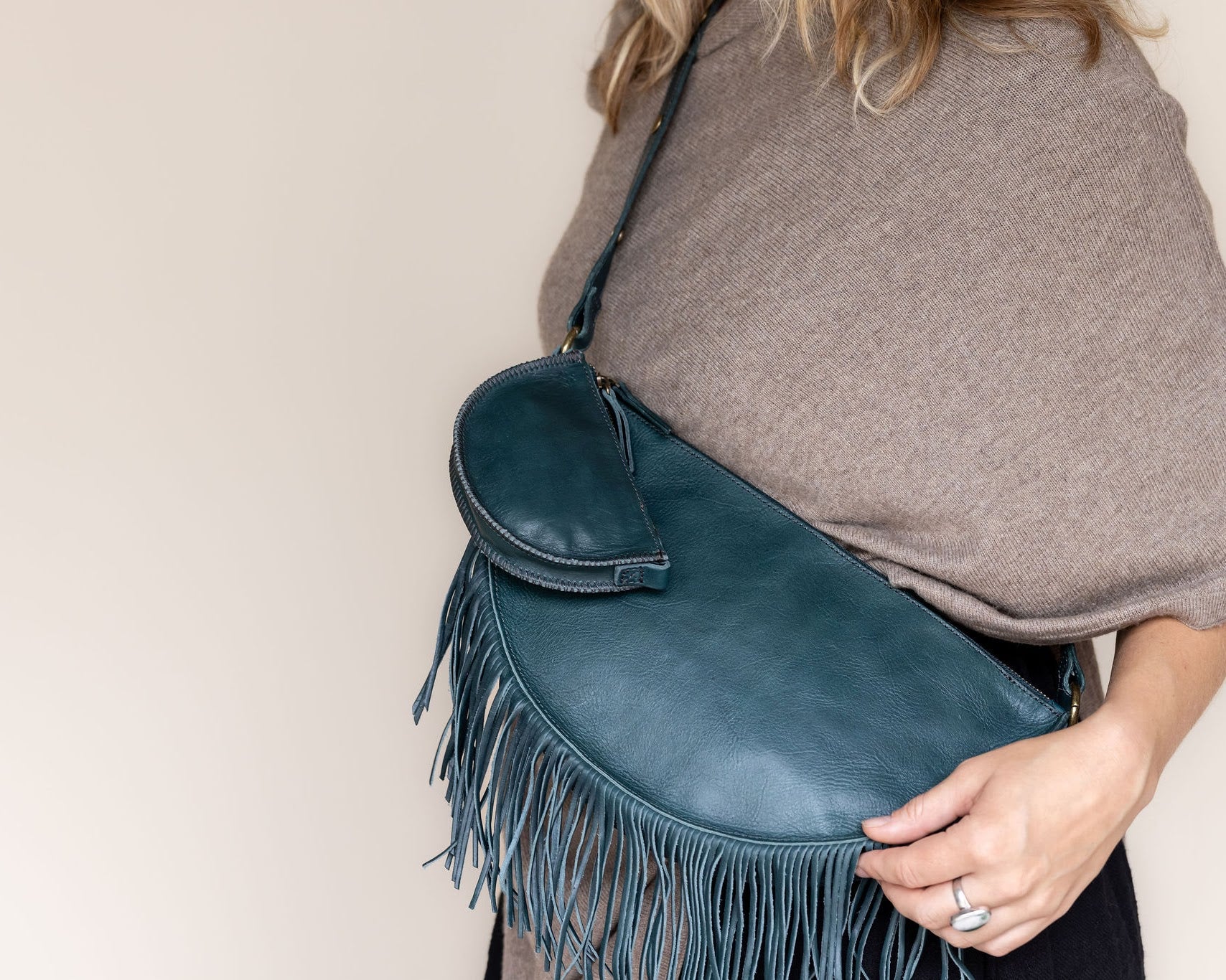 Mini teal leather pouch