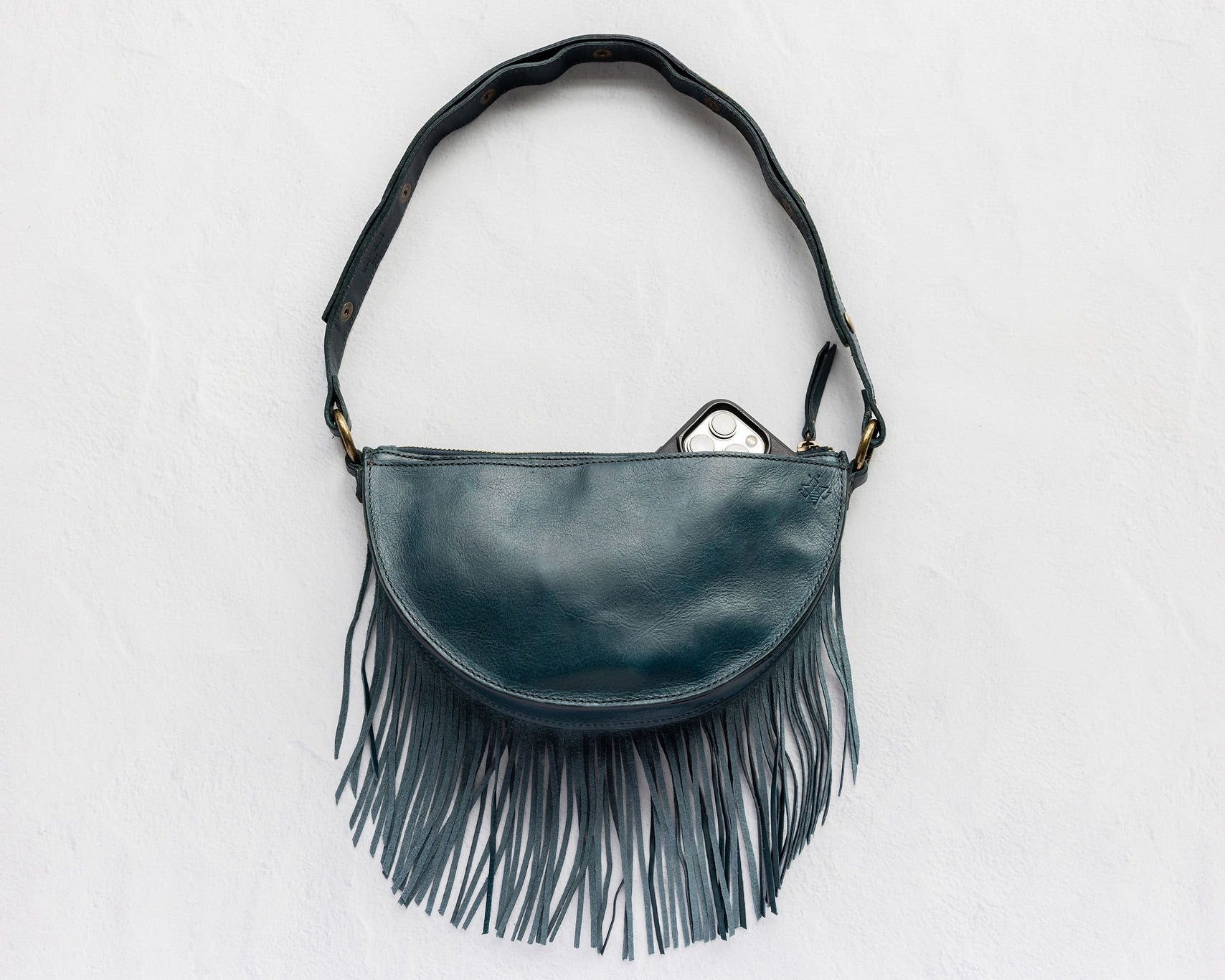 Small teal leather fringe pouch, crossbody bag, back with phone pocket