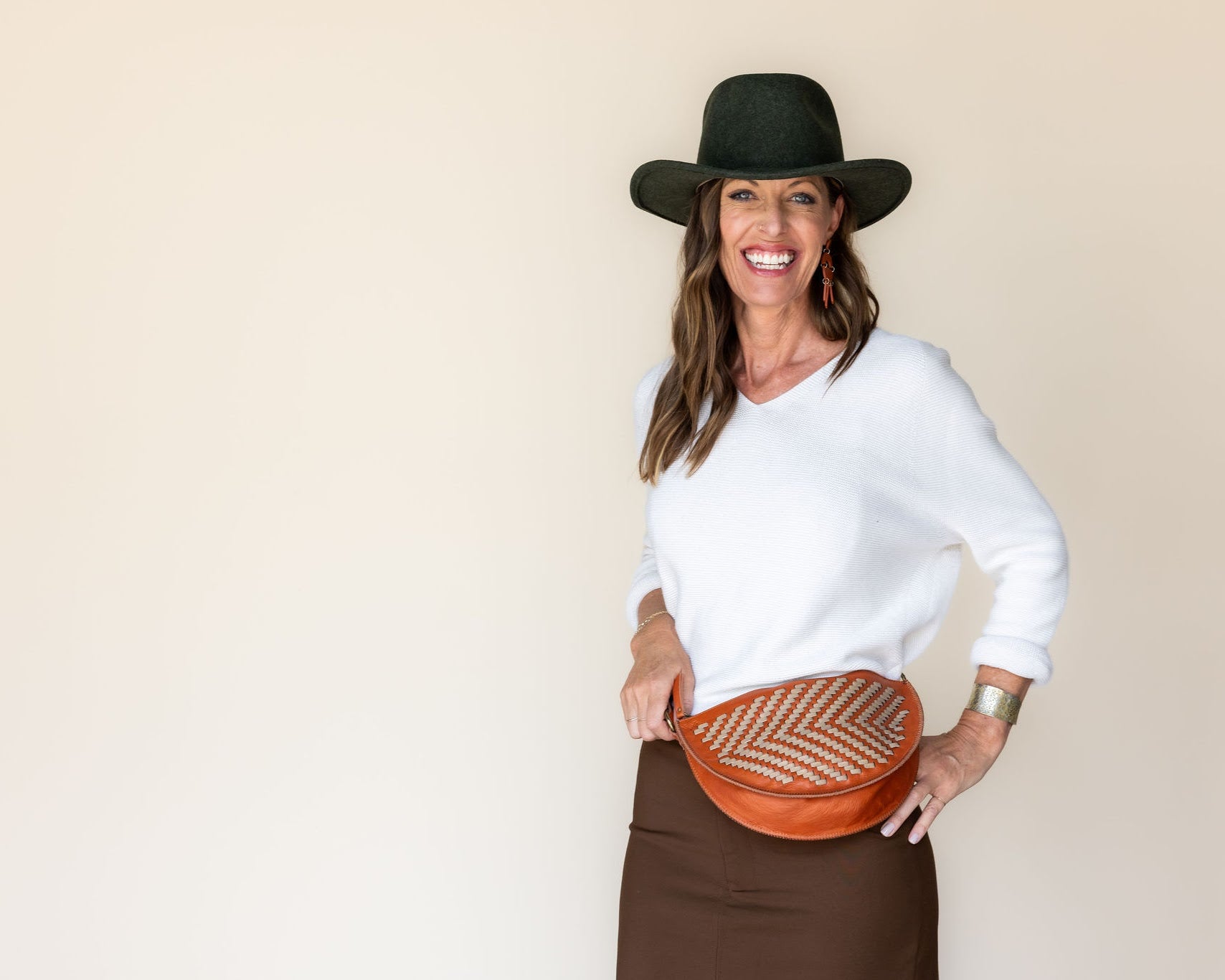 The Woven Terracotta & Seashell Biggie Bee worn at the waist