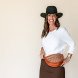 The Woven Terracotta & Seashell Biggie Bee worn at the waist