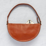 Back of the Woven Terracotta & Seashell Queen Bee showing the phone pocket