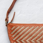 Close-up of the handwoven herringbone leather on the Woven Biggie Bee