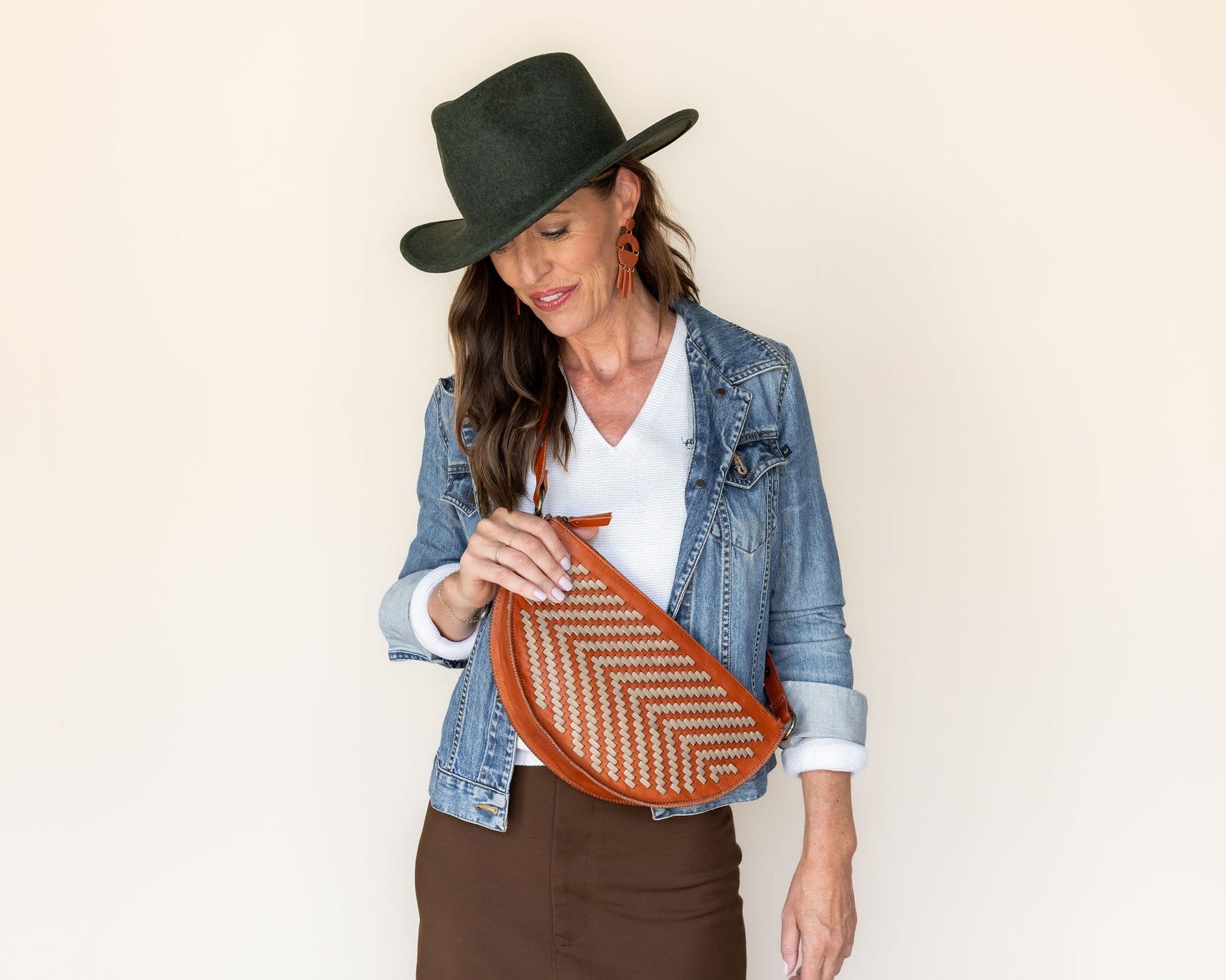 The Woven Terracotta & Seashell Queen Bee worn crossbody