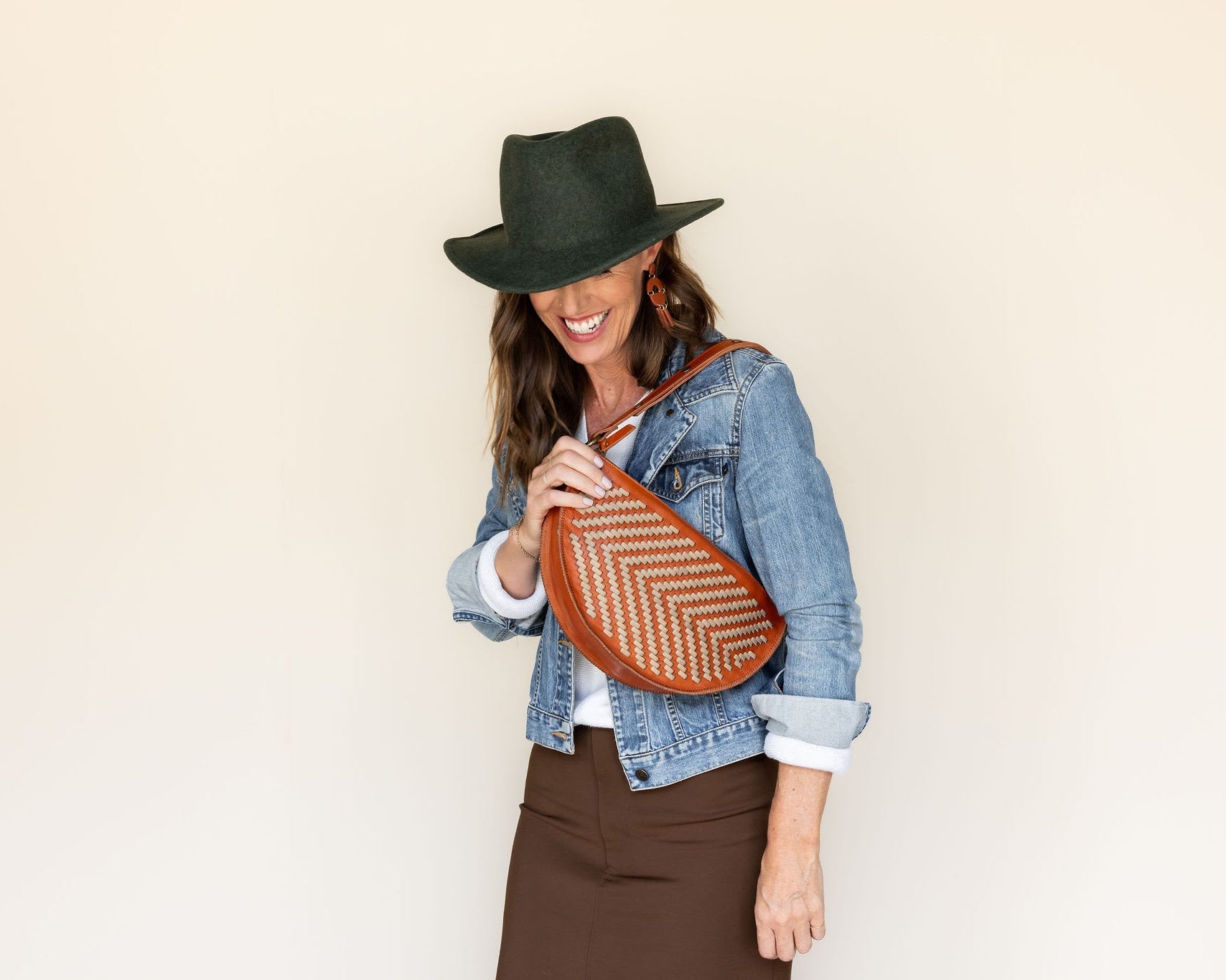 The Woven Terracotta & Seashell Queen Bee worn on the shoulder