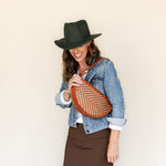 The Woven Terracotta & Seashell Queen Bee worn on the shoulder