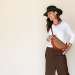 The Woven Terracotta & Seashell Biggie Bee worn across the body