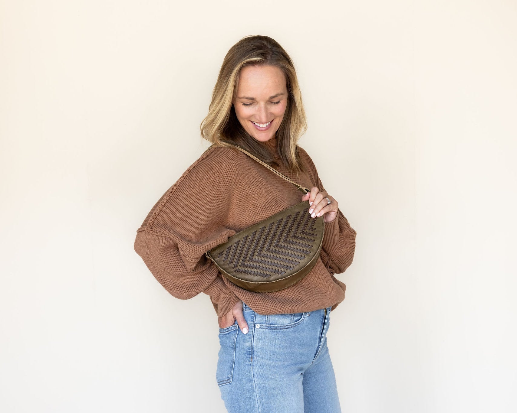 The Woven Sage & Espresso Biggie Bee worn on the shoulder