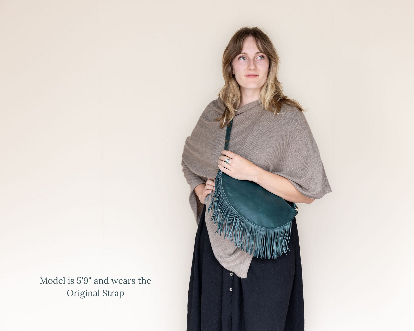 Large teal leather fringe crossbody bag