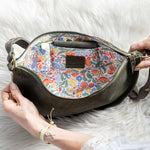 Handbag with floral interior on a white fur background