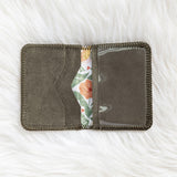 Gray fabric wallet with floral interior on a white textured background