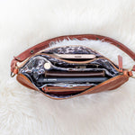 Brown leather handbag with a white fluffy surface underneath