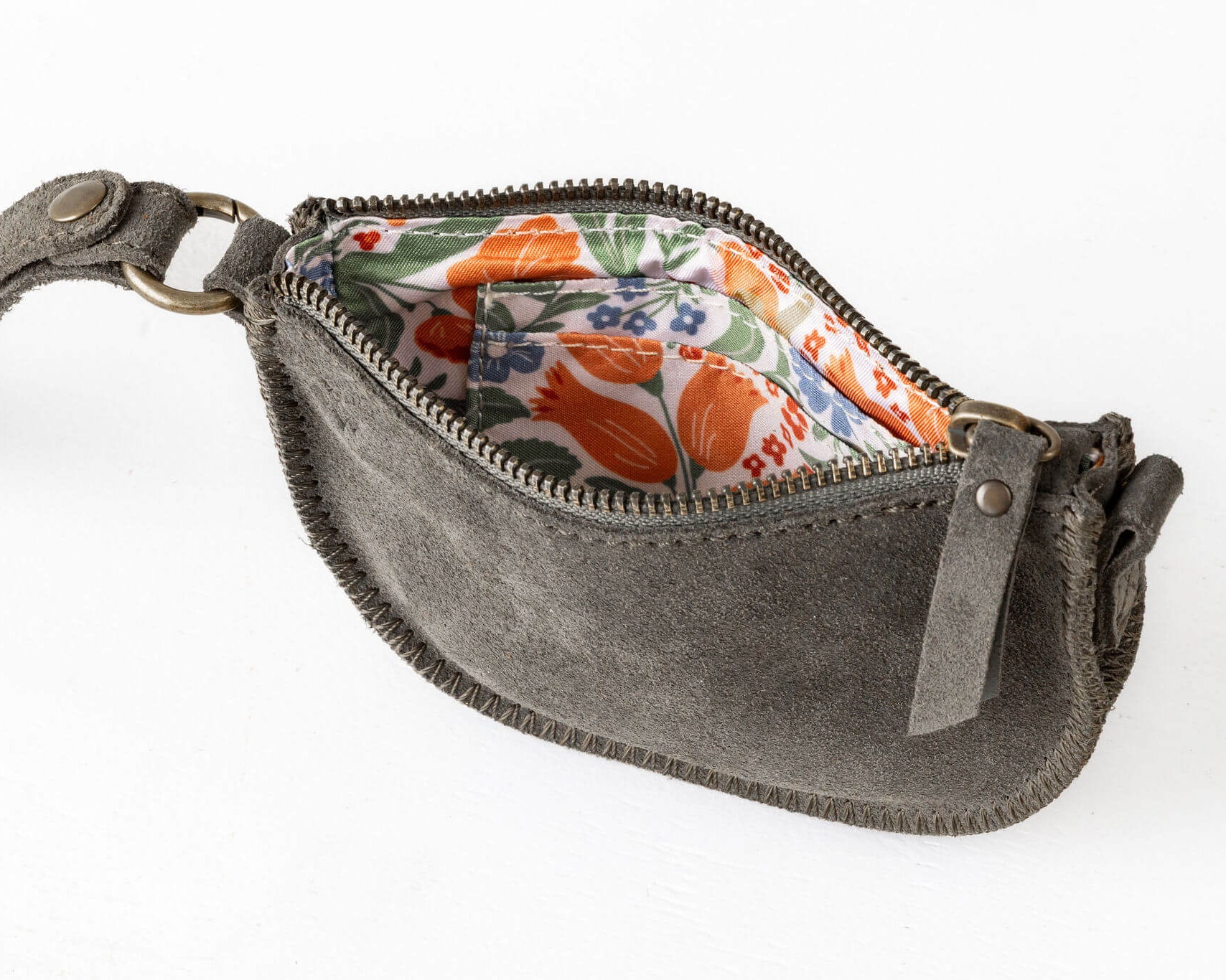 Gray pouch with floral interior on a white background