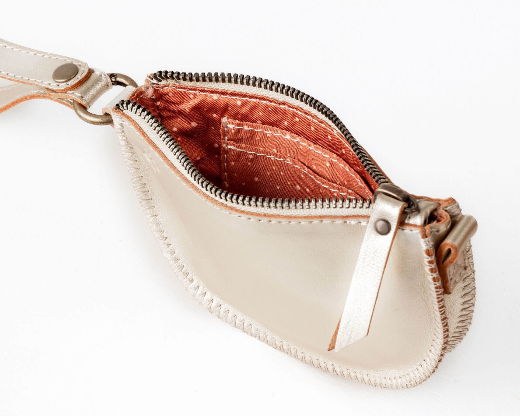 Beige leather bag with a zipper on a white background