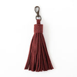 Red tassel keychain on a white background