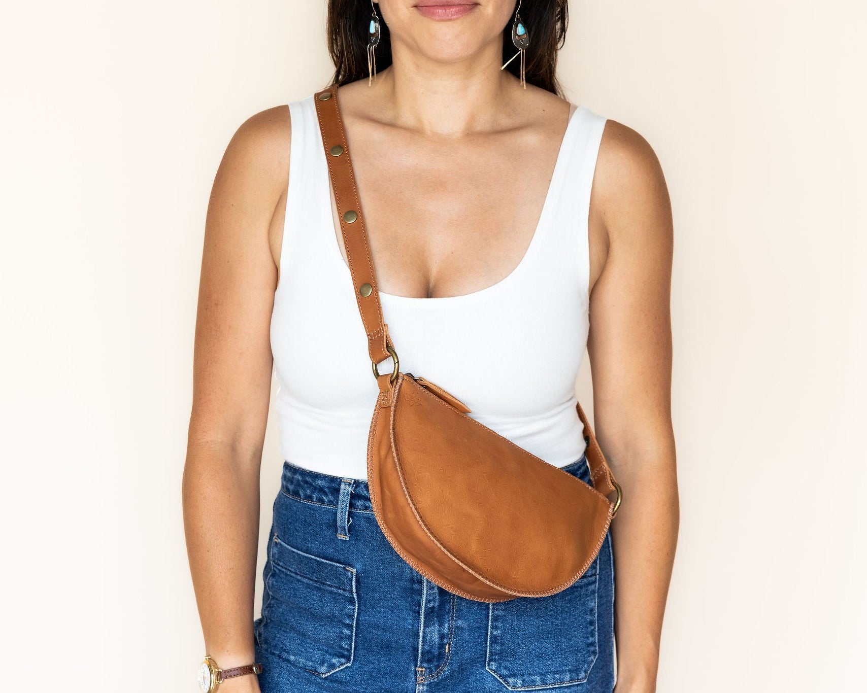 Woman wearing brown cross body bag