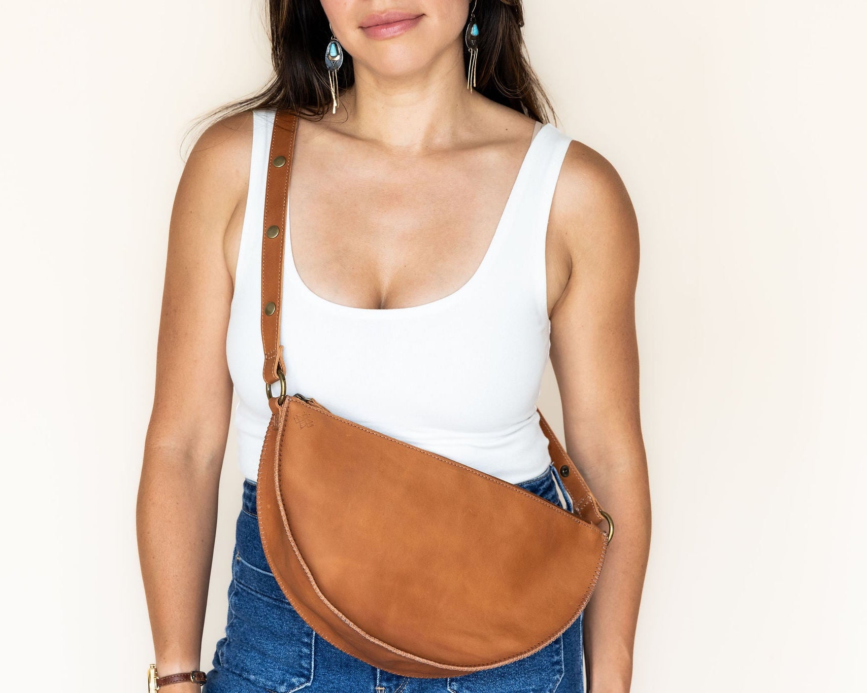 Person wearing a brown bag cross body