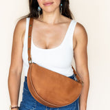 Person wearing a brown bag cross body