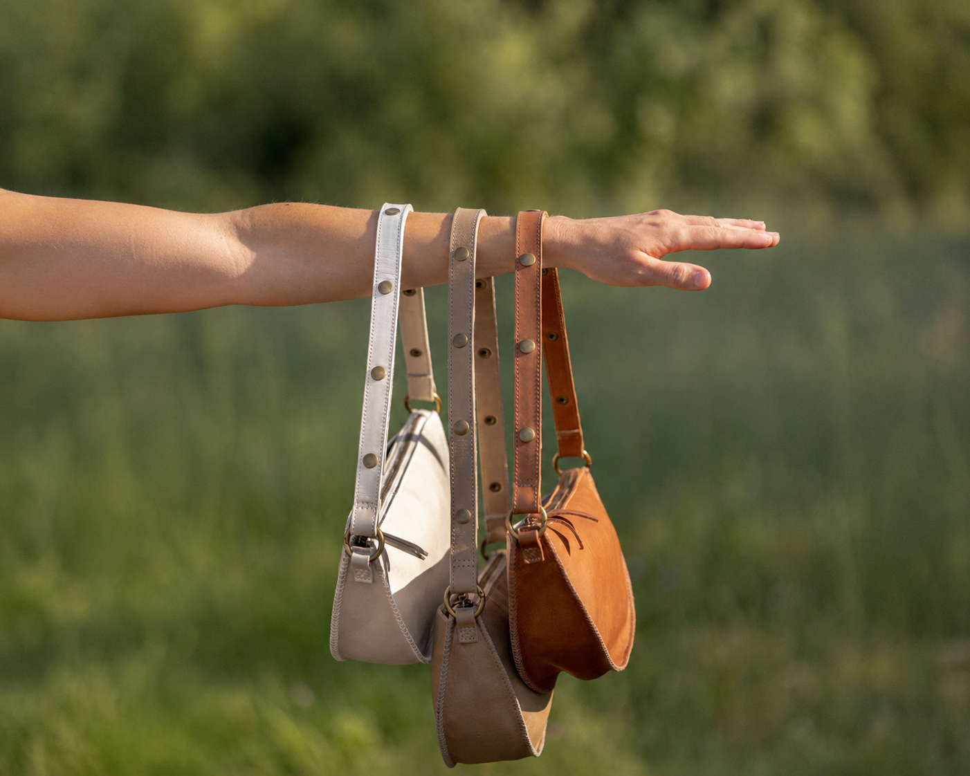 Person holding different color biggie bee bags